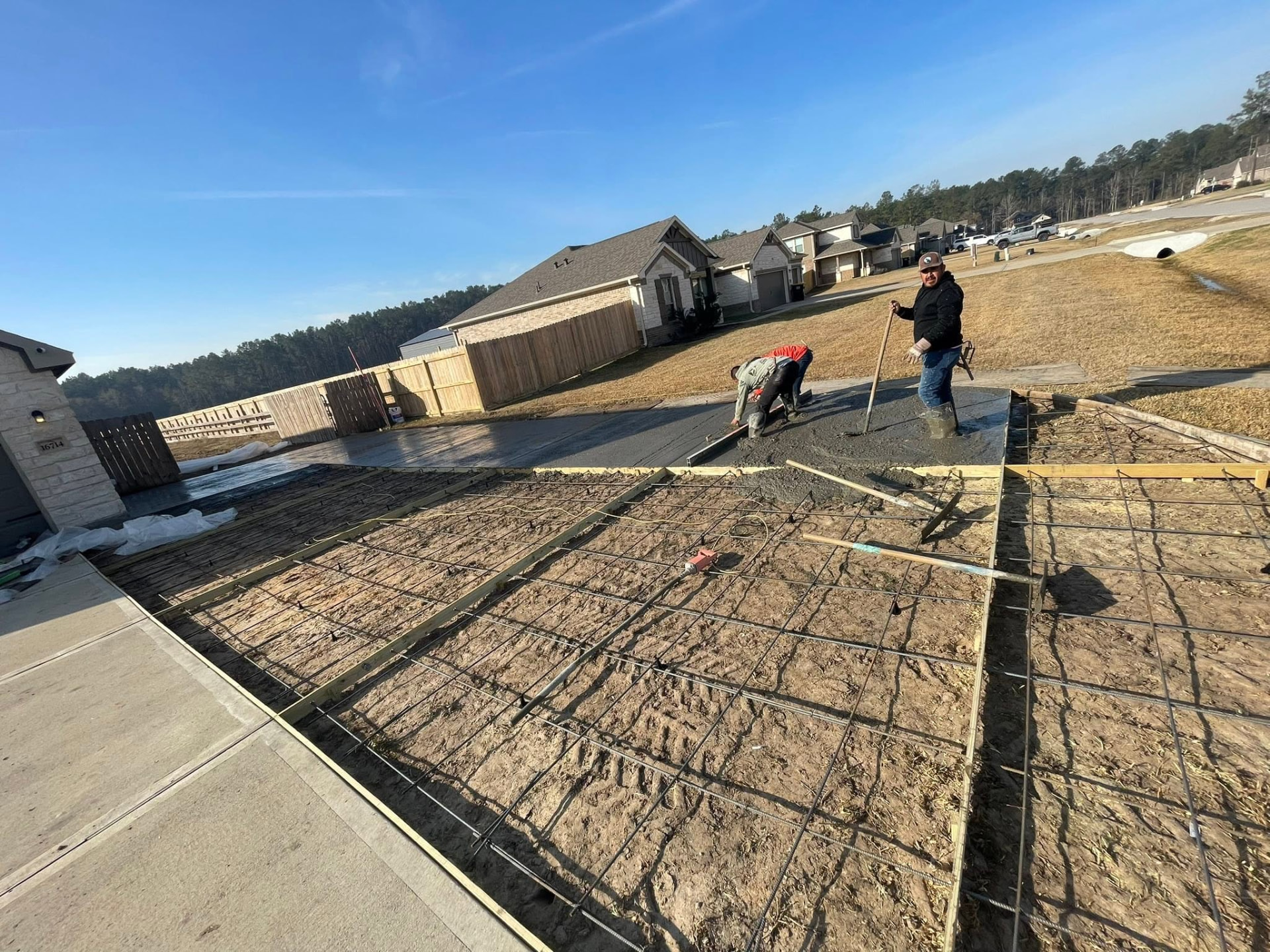 Blackwell crew screeding and leveling a fresh concrete pour over rebar