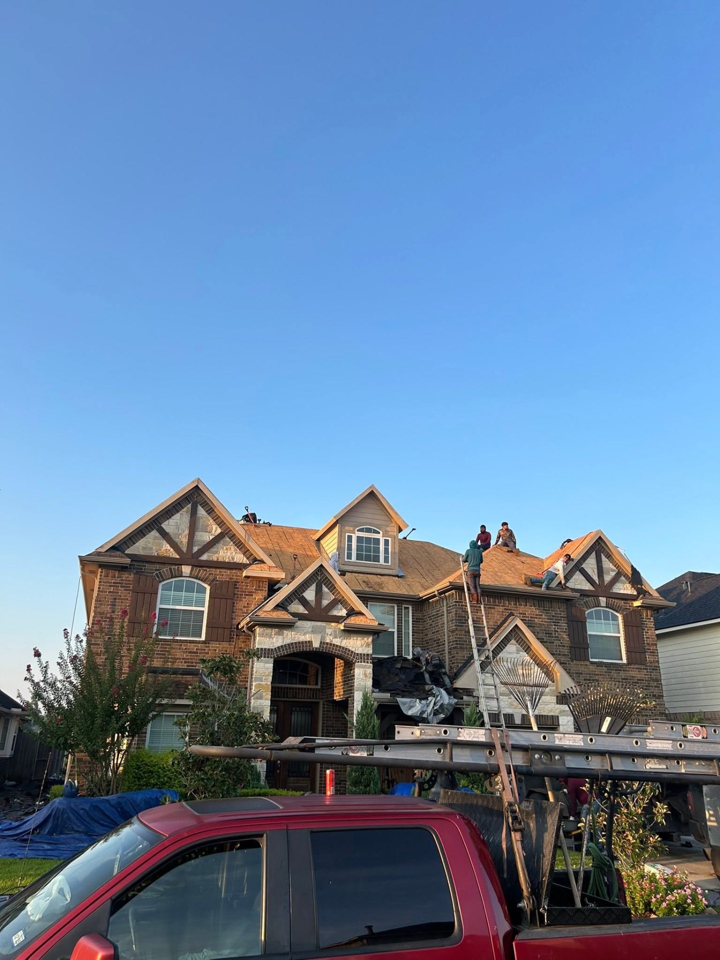 Active residential re-roof in progress with our crew on deck